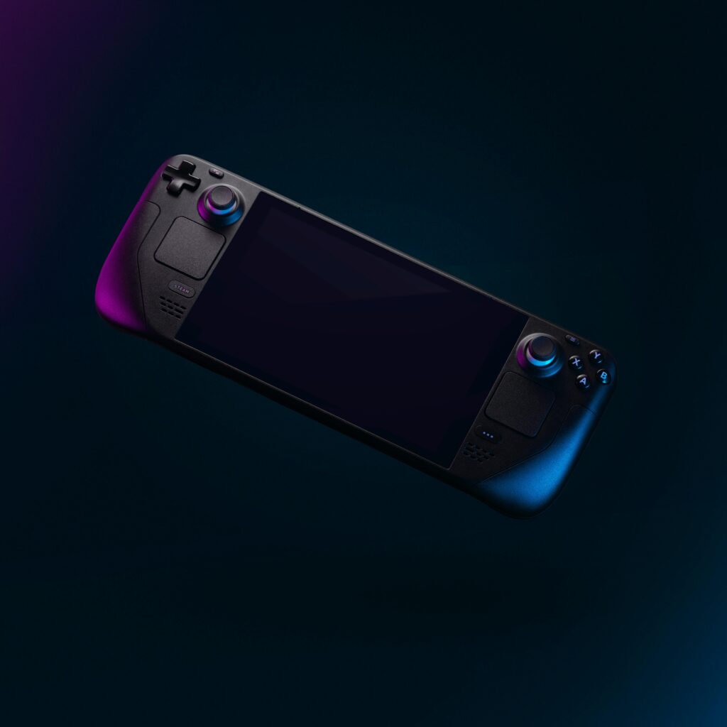 Elegant handheld gaming device with colorful backlighting against a dark backdrop.