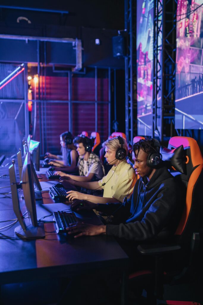 Group of focused gamers playing during a professional esports event.